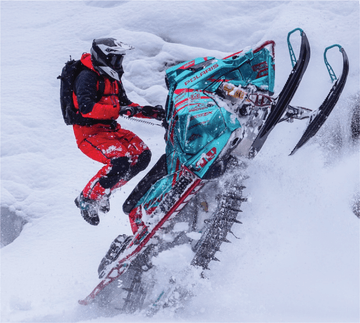 Athlete Caleb Kesterke riding a Polaris snowmobile with an ArcticFX Graphics wrap